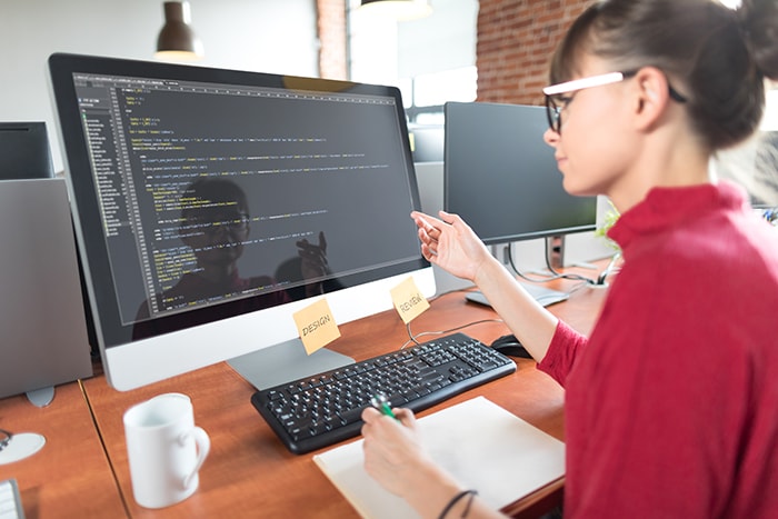 Woman working on computer code